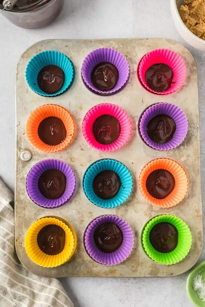 Melted chocolate layer in muffin tins.