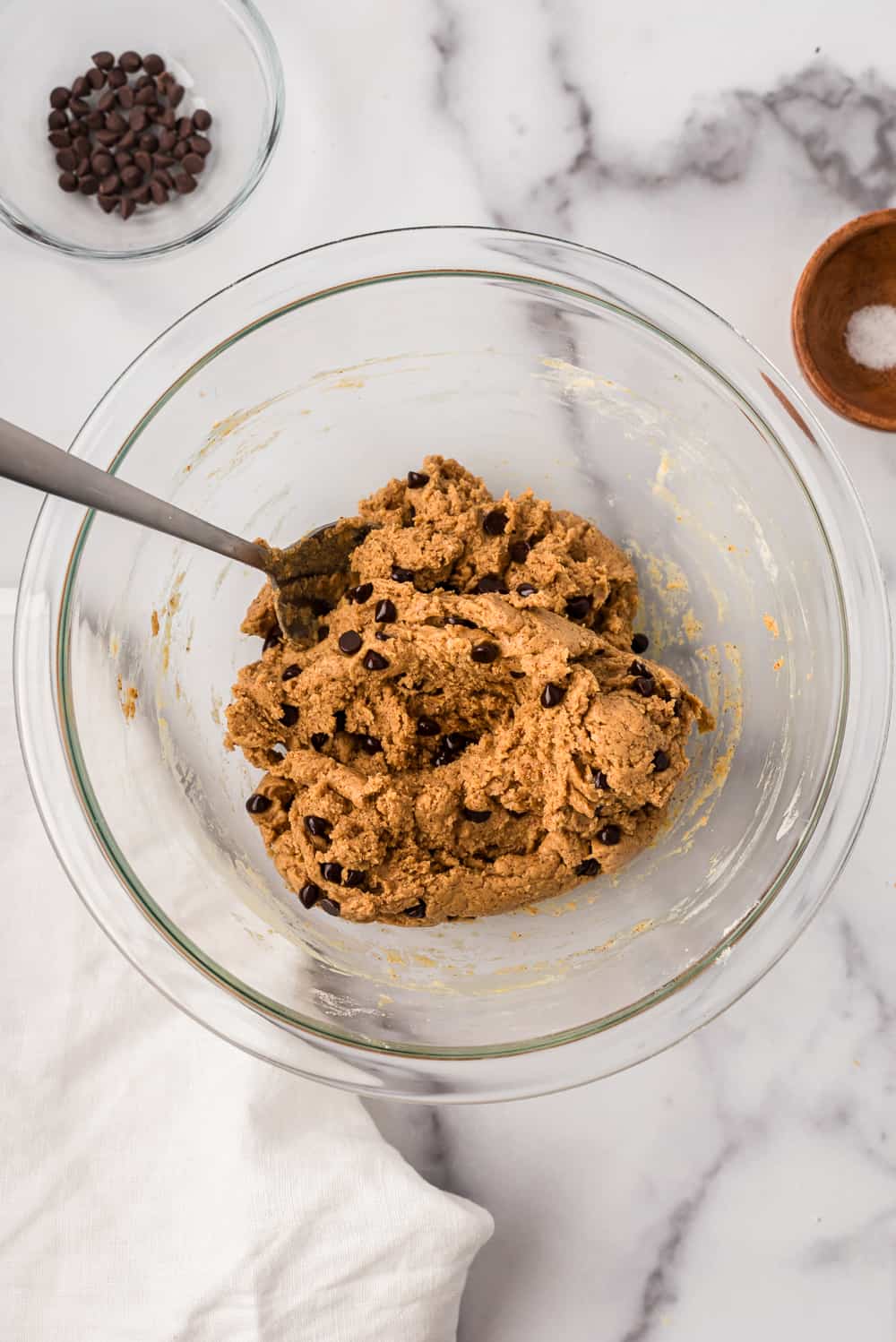 Chocolate chip almond butter protein mixture in bowl after mixing.