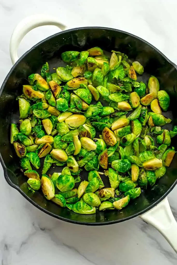 caramelized brussel sprouts in cast iron skillet. 