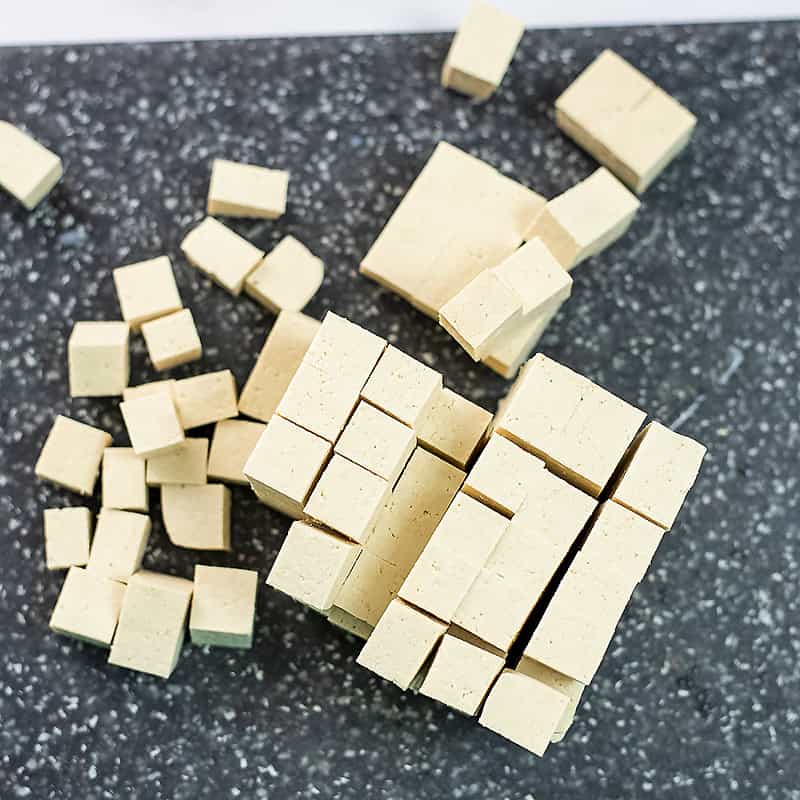 Pressed tofu cut into 1 inch cubes.