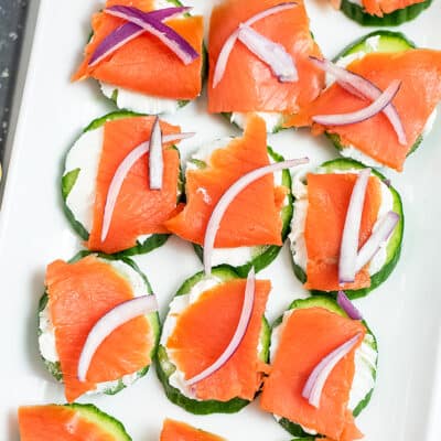 Cucumber smoked salmon bites on a patter.
