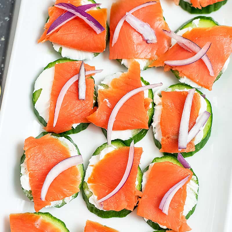 Cucumber smoked salmon bites on a patter.