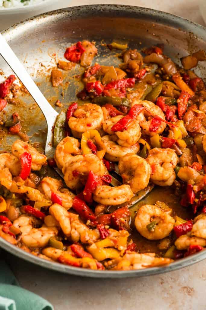 Fajita shrimp and bell peppers in a skillet