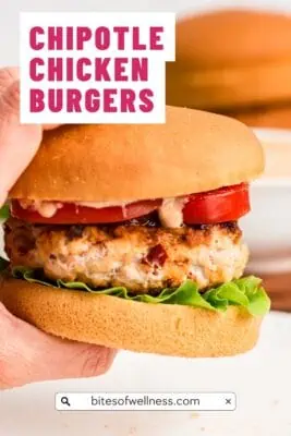 Hand holding chipotle chicken burger