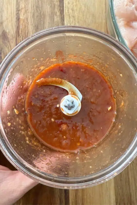 Pineapple chipotle sauce in a small food processor.