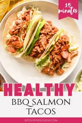 Three bbq salmon tacos on a white plate