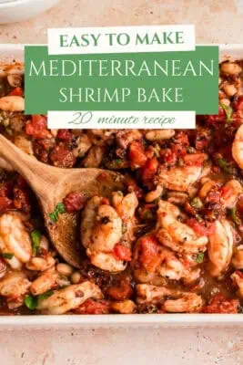 Spoon picking up shrimp from casserole dsih.