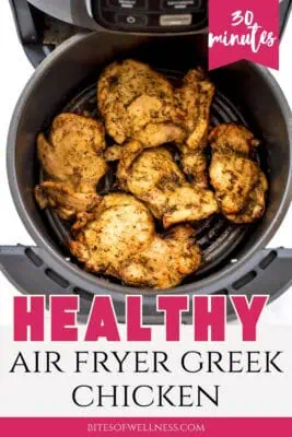 Greek chicken in air fryer basket after cooking.
