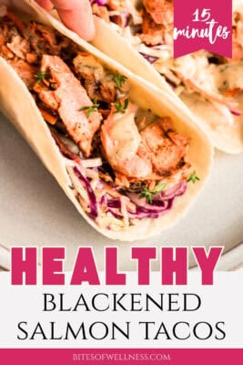 Single blackened salmon taco on a white plate.