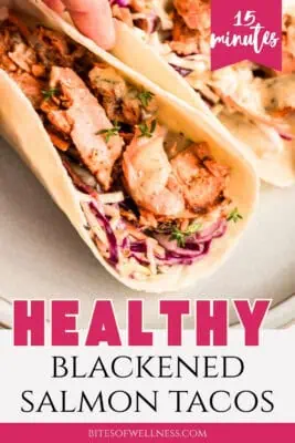 Single blackened salmon taco on a white plate.