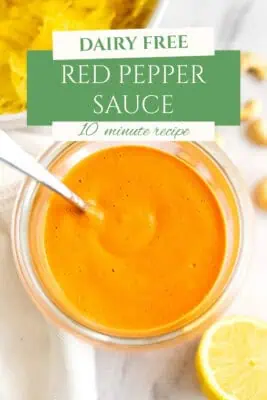 Glass container filled with roasted red pepper sauce.