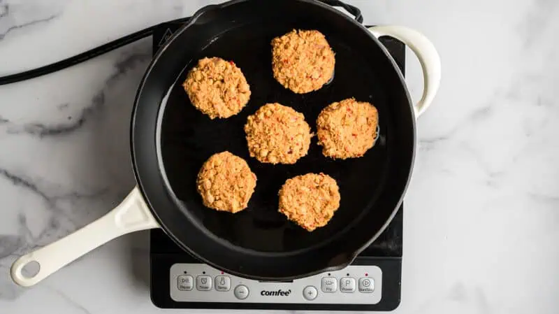Chickpea fritters before cooking in cast iron skillet.