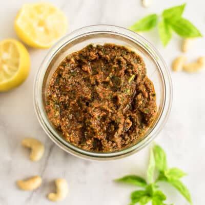 Glass jar filled with sundried tomato pesto.